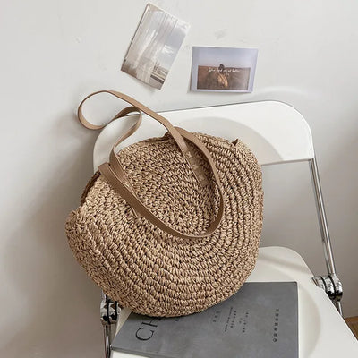 Arnora | Elegant round woven handbag with stylish faux leather straps