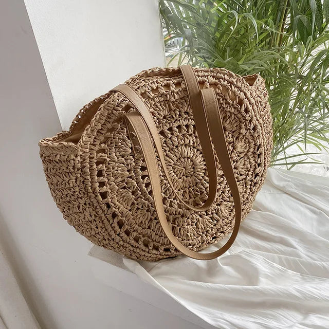 Arnora | Elegant round woven handbag with stylish faux leather straps