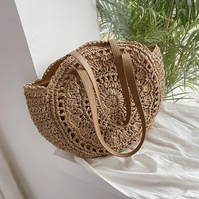 Arnora | Elegant round woven handbag with stylish faux leather straps