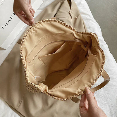 Arnora | Elegant round woven handbag with stylish faux leather straps